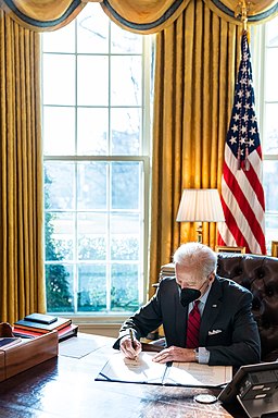 President Joe Biden signs the 'Ghost Army Congressional Gold Medal Act,' Tuesday, February 1, 2022, in the Oval Office. (Official White House Photo by Adam Schultz)